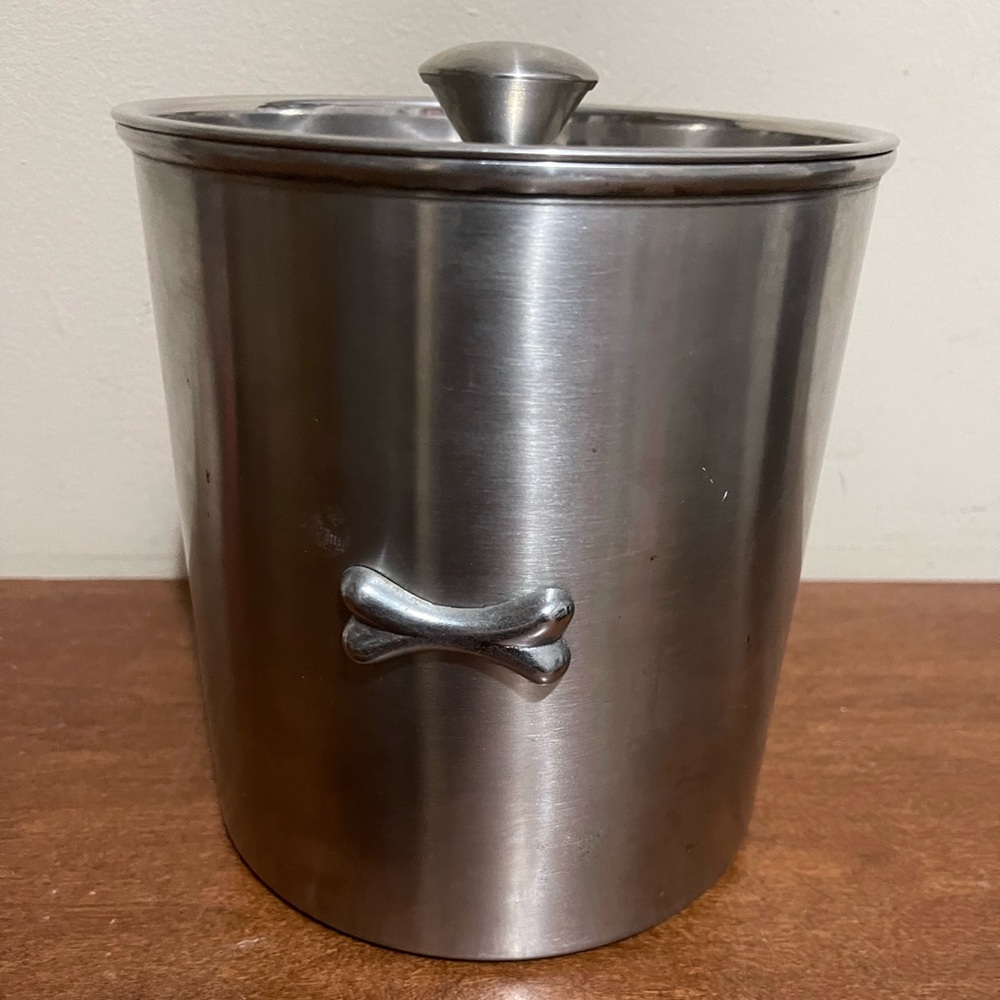 Pet treat silver container with bone on it 
By Boots & Barkley